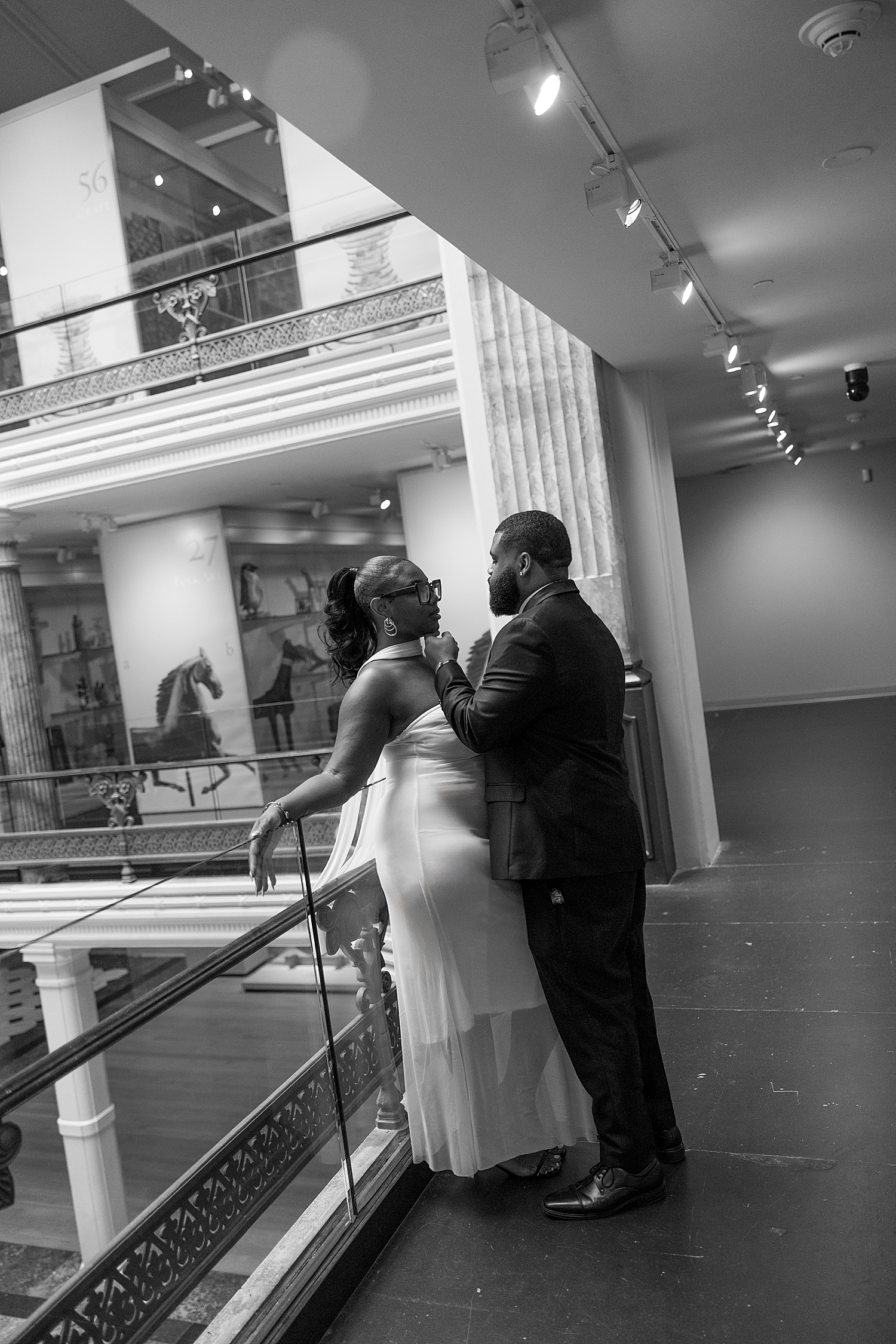 man tips up his bride-to-be's chin by Maryland wedding photographer