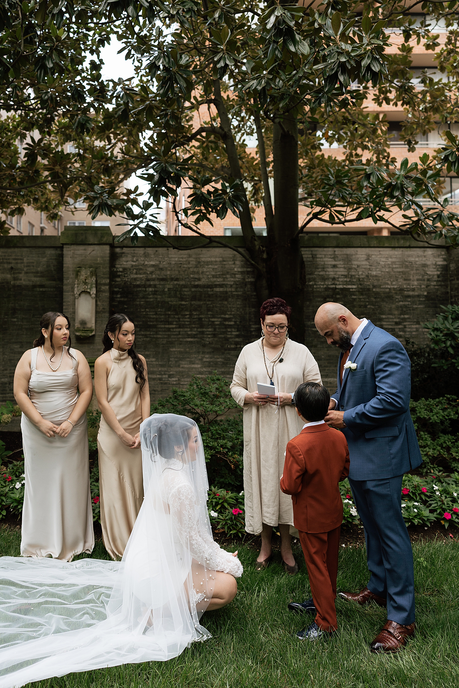 bride leans down to comfort son during Anderson House Elopement