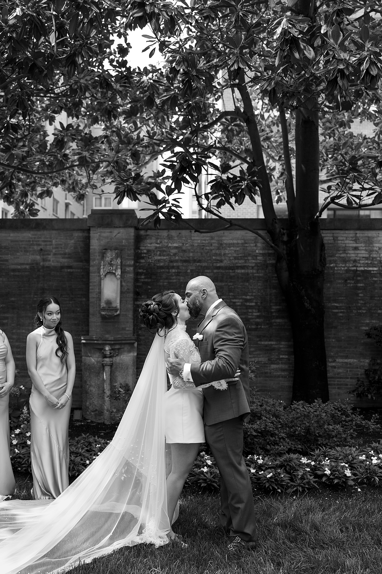 husband and wife share a first kiss afer vows by Sharp Impressions Photography