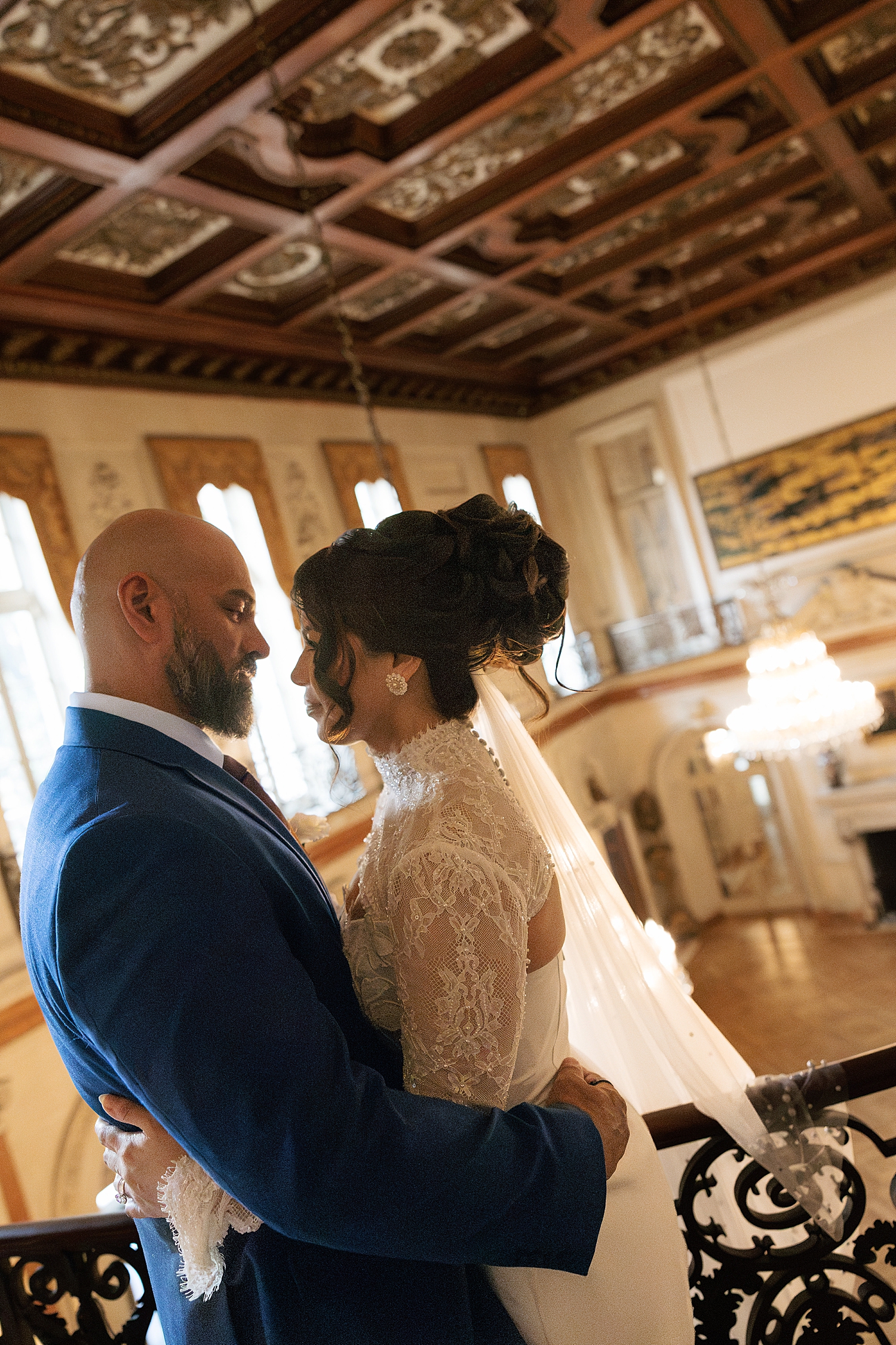 newlyweds embrace in grand foyer for Anderson House Elopement