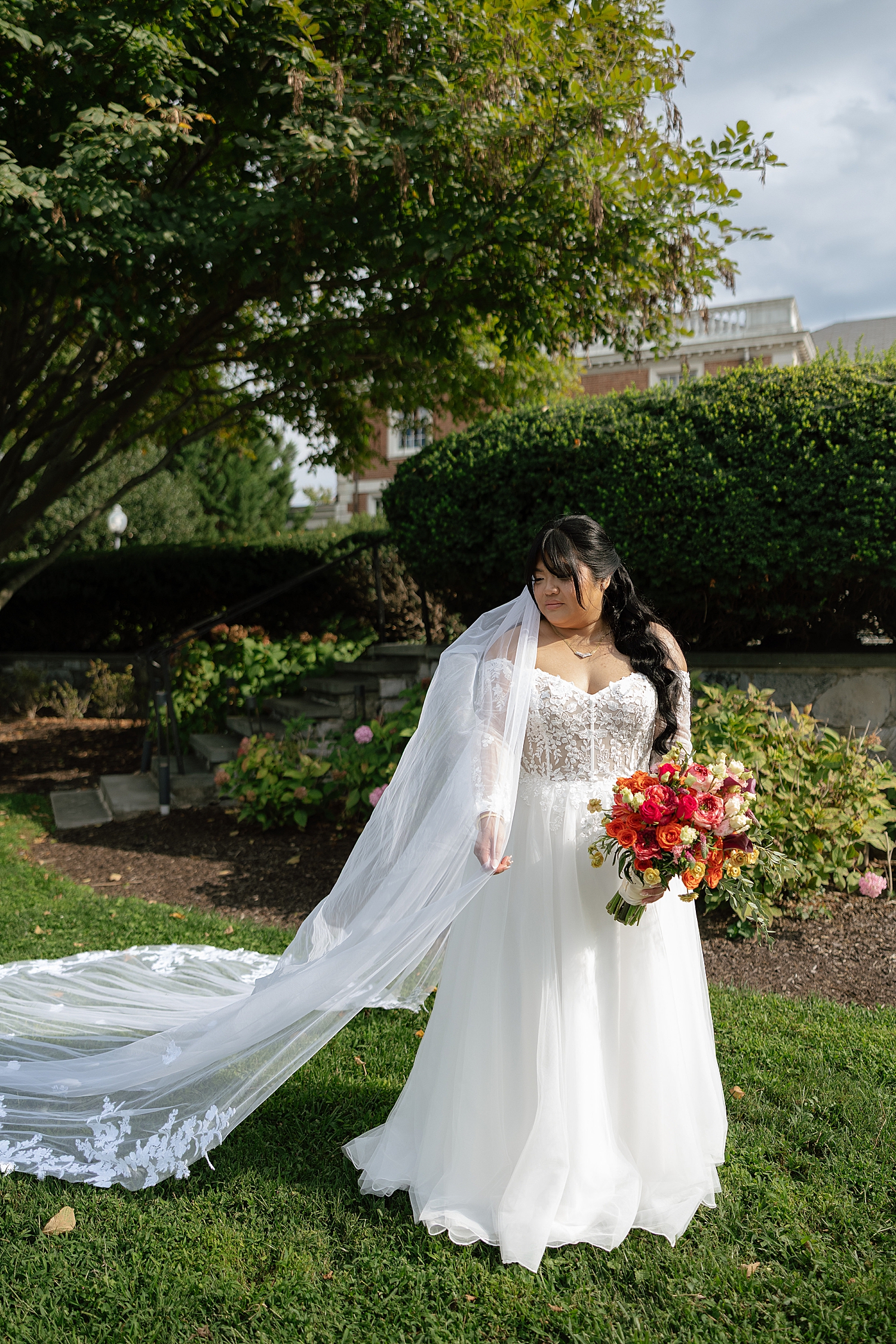 brunette bride in garden at The Mansion at Strathmore