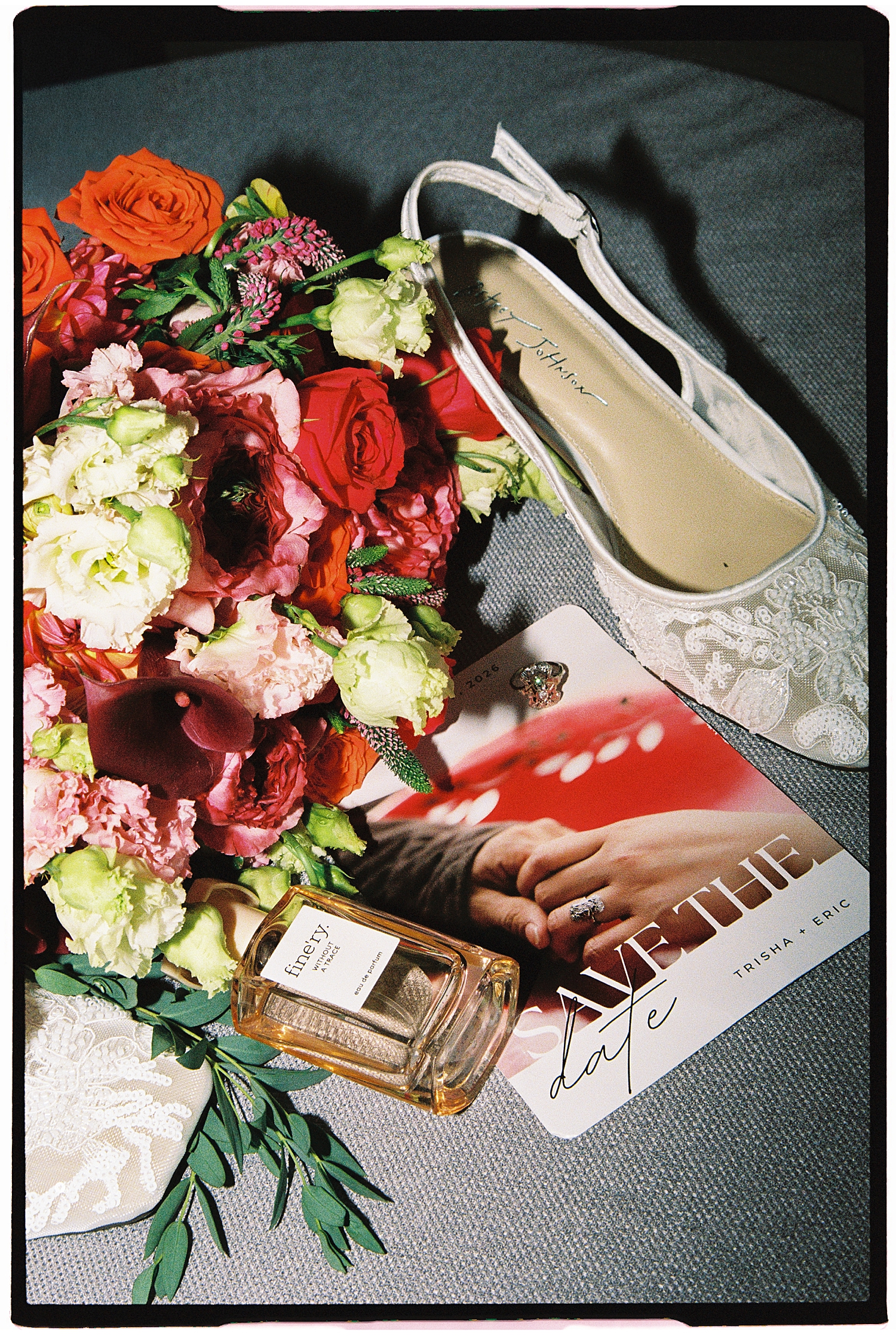 bouquet of flowers, shoes and save the date on table at The Mansion at Strathmore