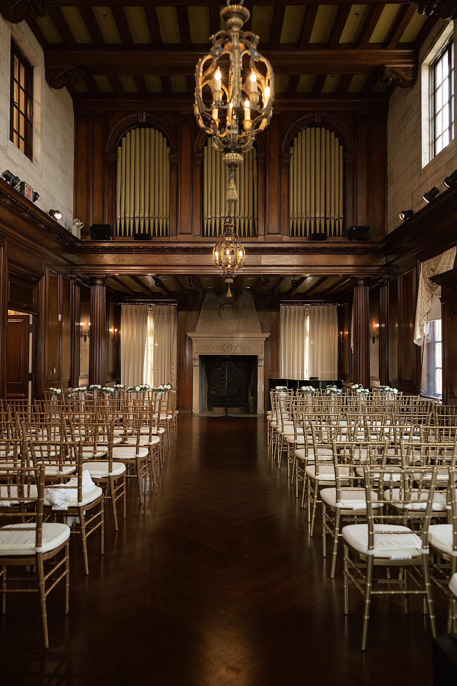 long rows of chairs set up for ceremony indoors by Maryland wedding photographer
