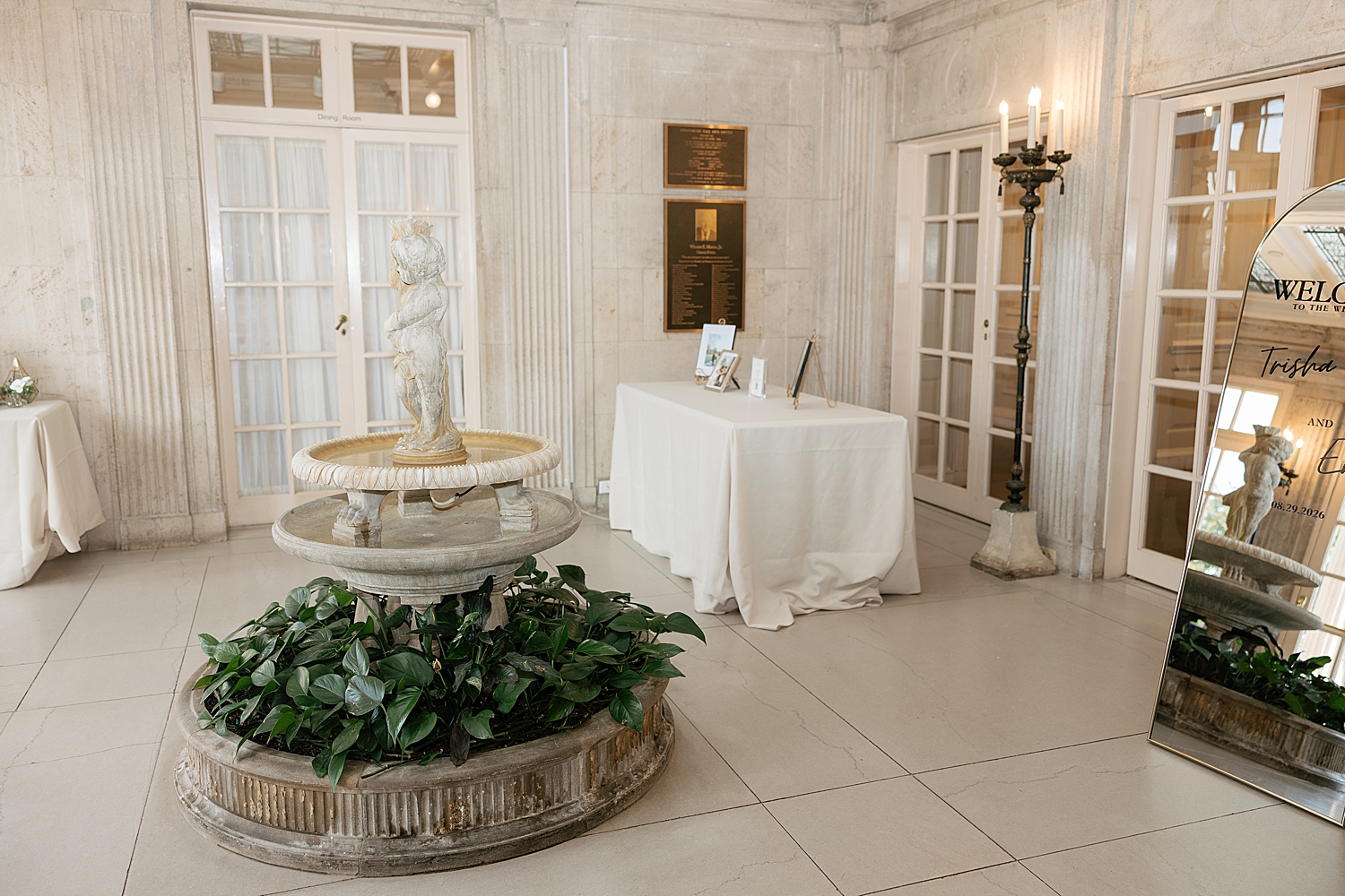 welcome table set up in atrium at historic east coast venue by Sharp Impressions Photography